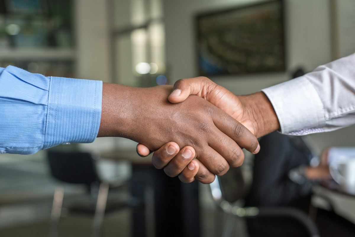 Professionals meeting in a law office about a workplace matter